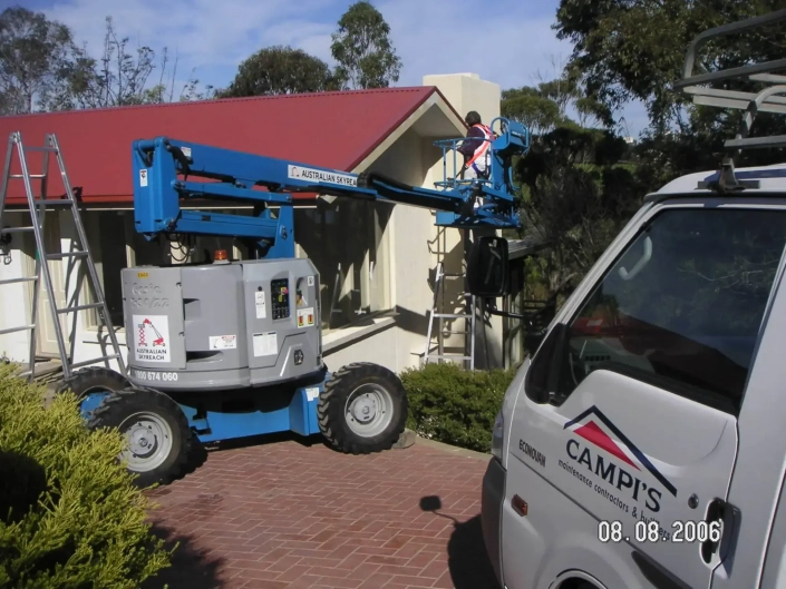 Campis Maintenance Worker on Boom Lift